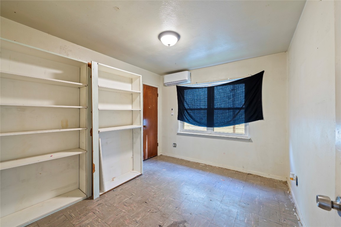 2308 Grape Lane Pasadena, TX 77502 - Photo 16 of 19 a view of an empty room with cabinet and a window
