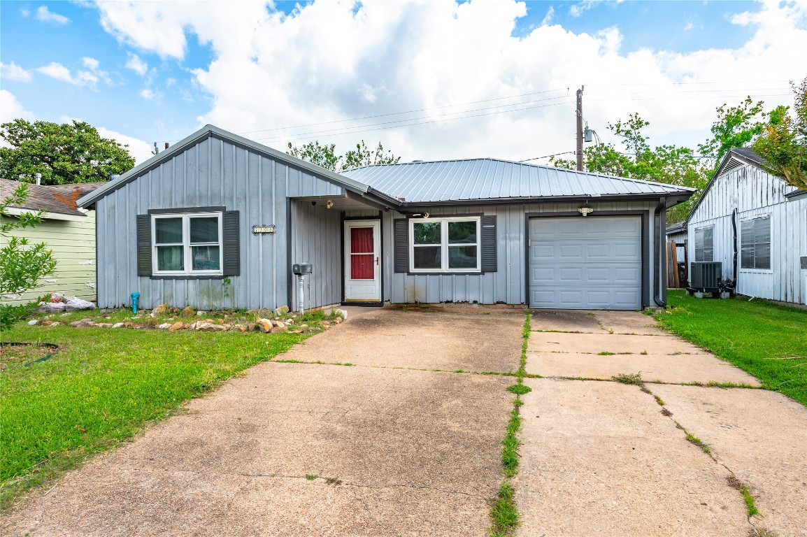 2308 Grape Lane Pasadena, TX 77502 - Photo 2 of 19 a view of garage yard and front view of a house