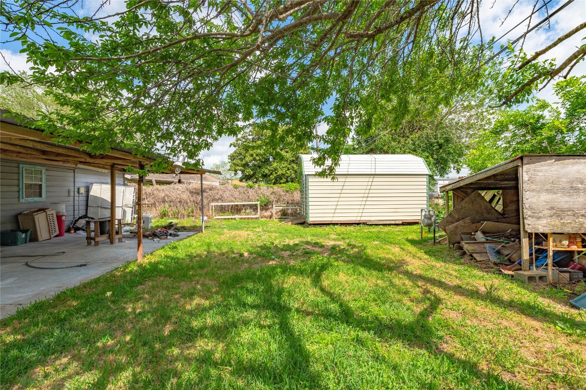 2308 Grape Lane Pasadena, TX 77502 - Photo 7 of 19 a backyard of a house with seating space