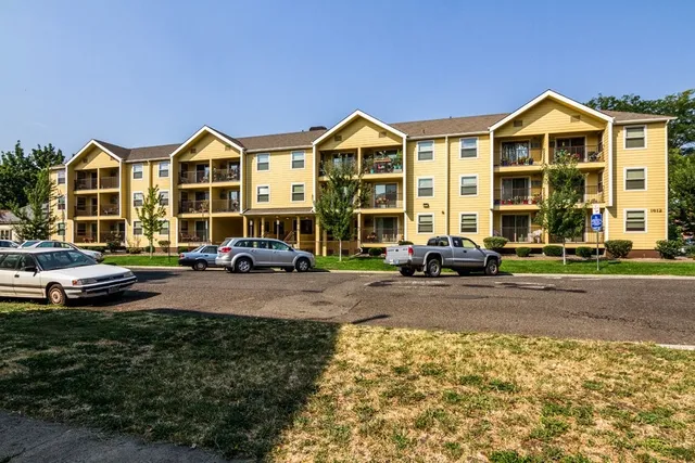 a view of multiple houses with a yard