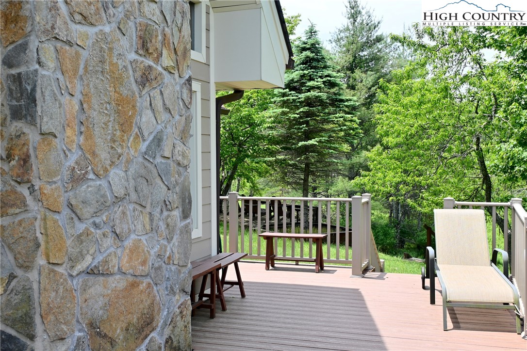 280 Smoky Hollow Road Laurel Springs, NC 28644 - Photo 28 of 42 a view of balcony with wooden floor and outdoor seating