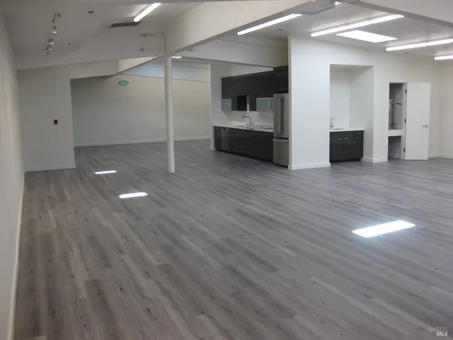 a view of a livingroom with wooden floor