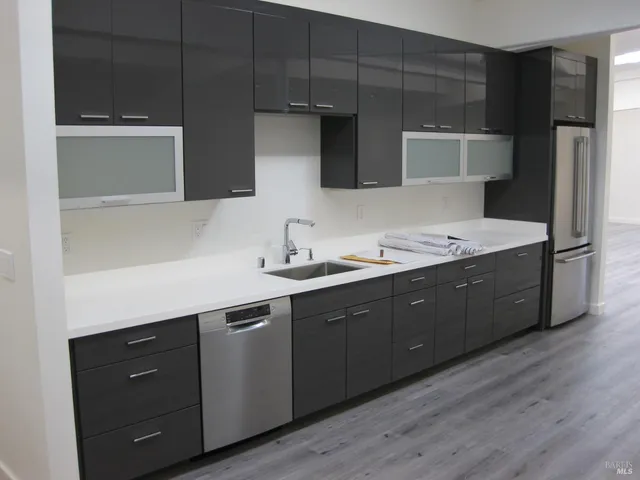 a spacious bathroom with a double vanity sink and mirror