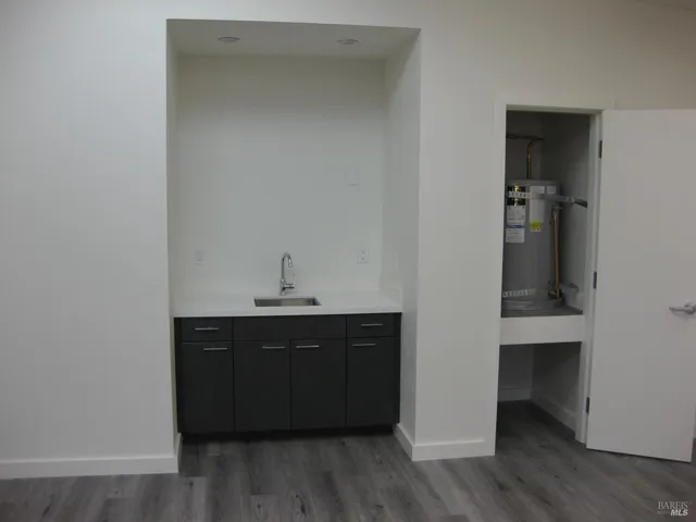 a kitchen with a sink and cabinets