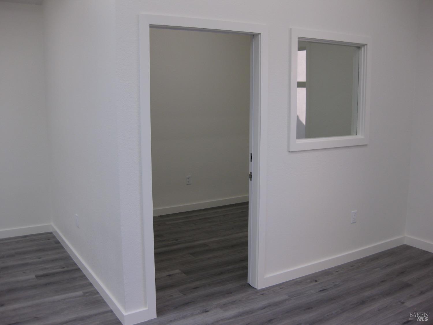 18615 Highway 12 Sonoma, CA 95476 - Photo 10 of 12 a view of an empty room with wooden floor