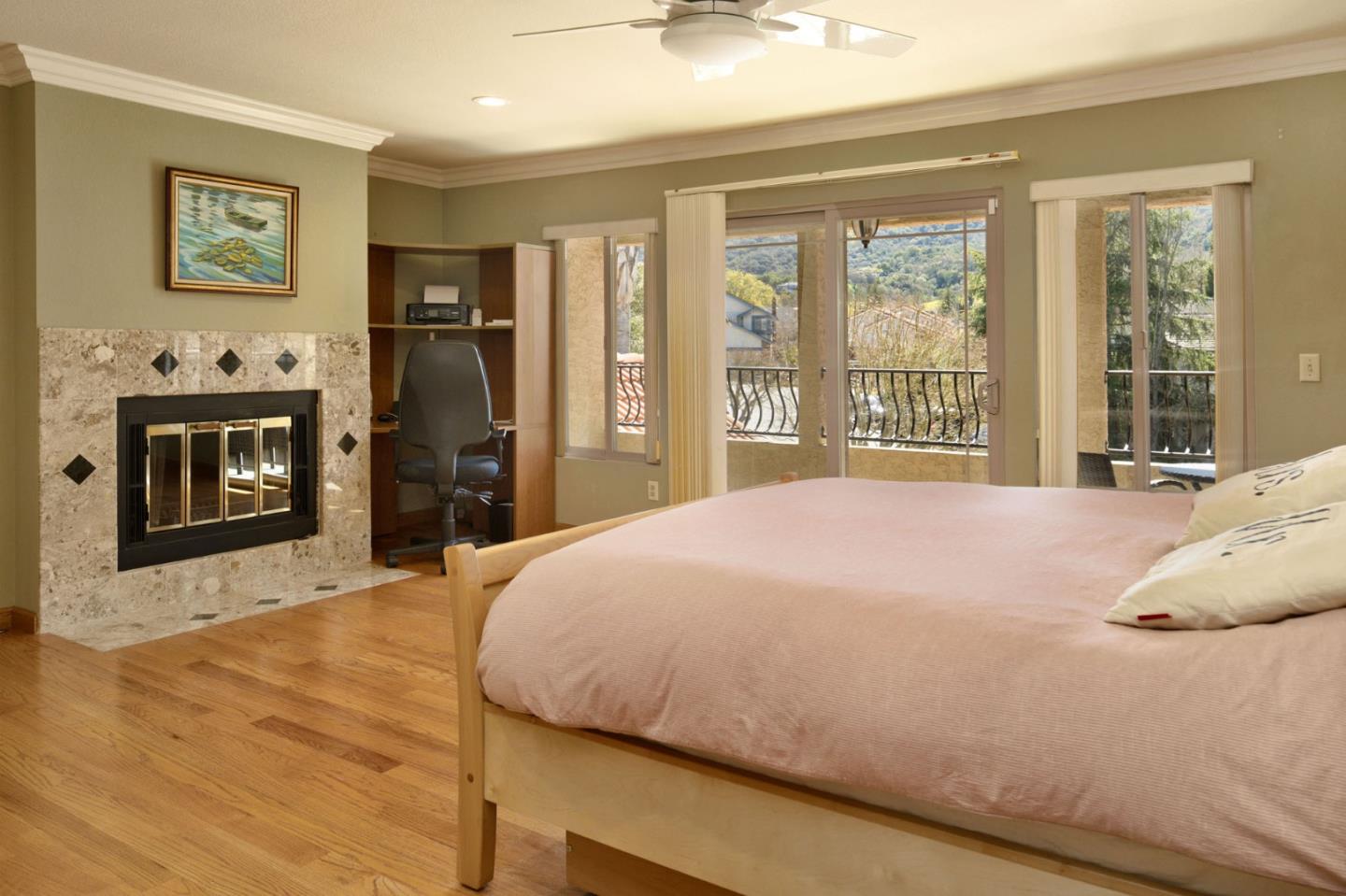 1127 Carnforth Court San Jose, CA 95120 - Photo 23 of 55 a bedroom with a bed a fireplace and a flat tv screen on dresser