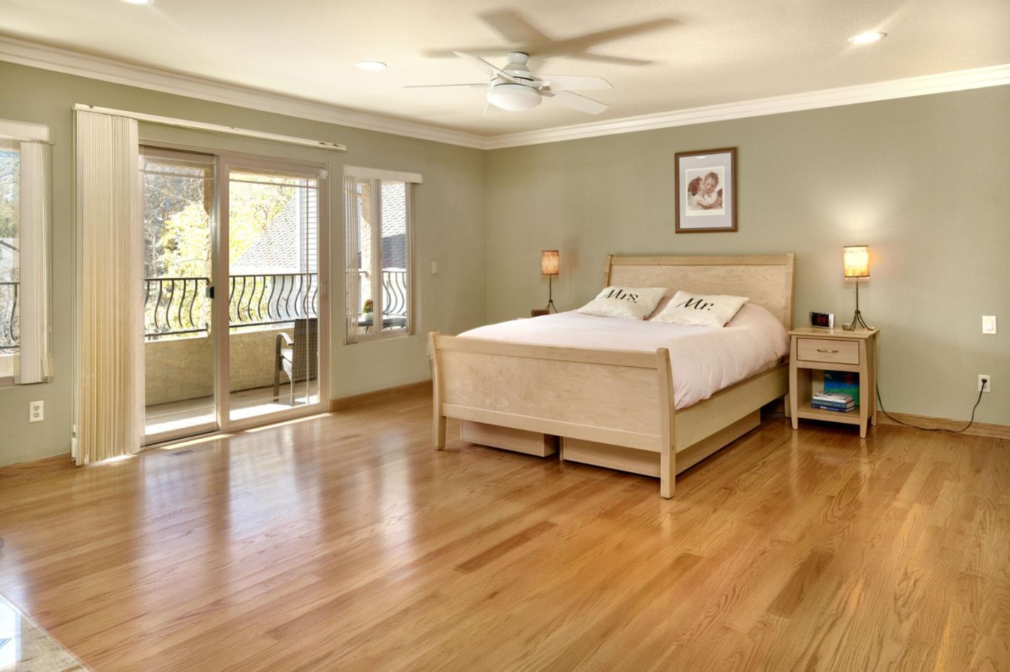 1127 Carnforth Court San Jose, CA 95120 - Photo 26 of 55 a bedroom with a bed and large windows