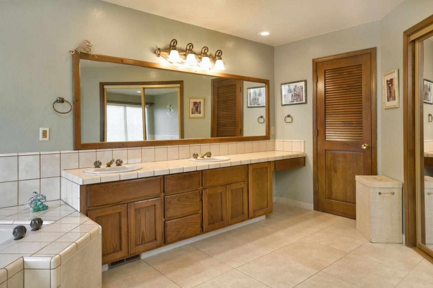 1127 Carnforth Court San Jose, CA 95120 - Photo 27 of 55 a spacious bathroom with a double vanity sink mirror and double