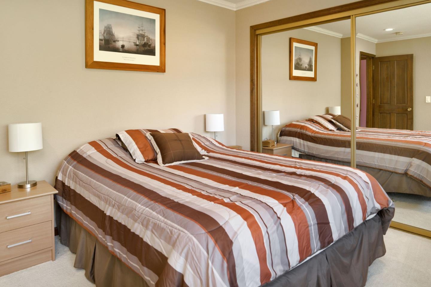 1127 Carnforth Court San Jose, CA 95120 - Photo 32 of 55 a bedroom with double bed and a night stand