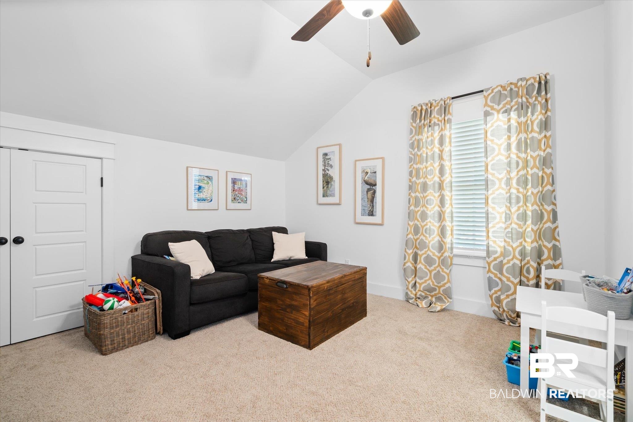 15 Semmes Avenue Mobile, AL 36604 - Photo 19 of 43 Carpeted living room featuring a wealth of natural light, ceiling fan, and lofted ceiling