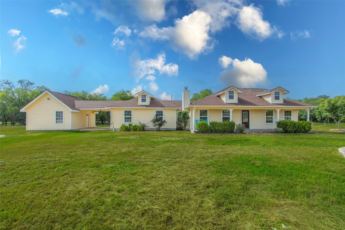 14596 Touchstone Road, Unit 3 Atascosa, TX 78002 - Photo 1 of 1 a front view of a house with a garden