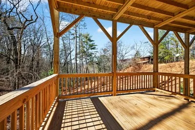 a view of balcony with wooden floor