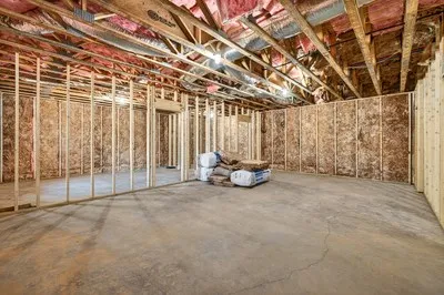 a view of a room with an empty space and wooden roof