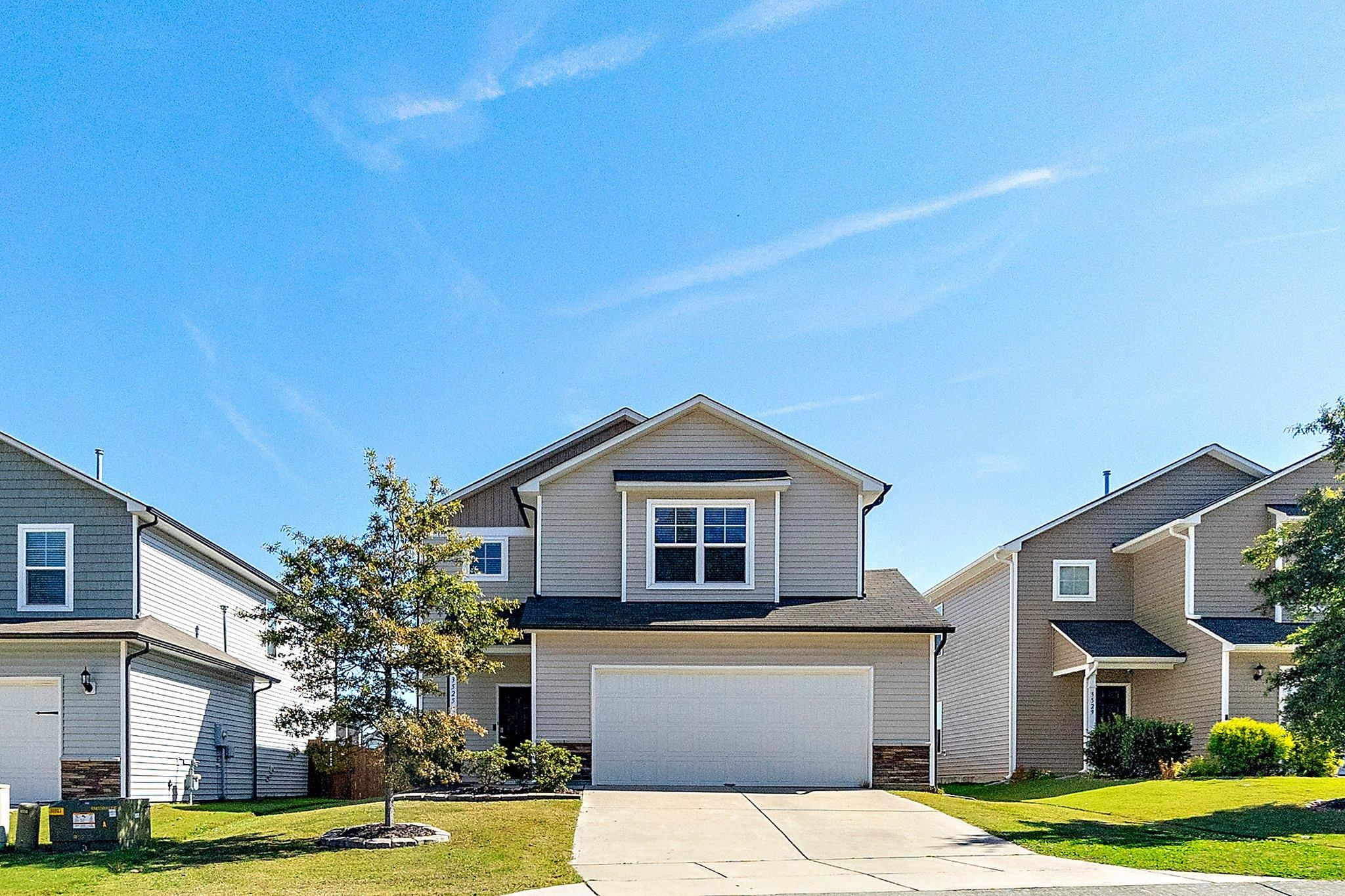 3525 Althorp Drive Raleigh, NC 27616 - Photo 2 of 28 a front view of a house with a garden and yard