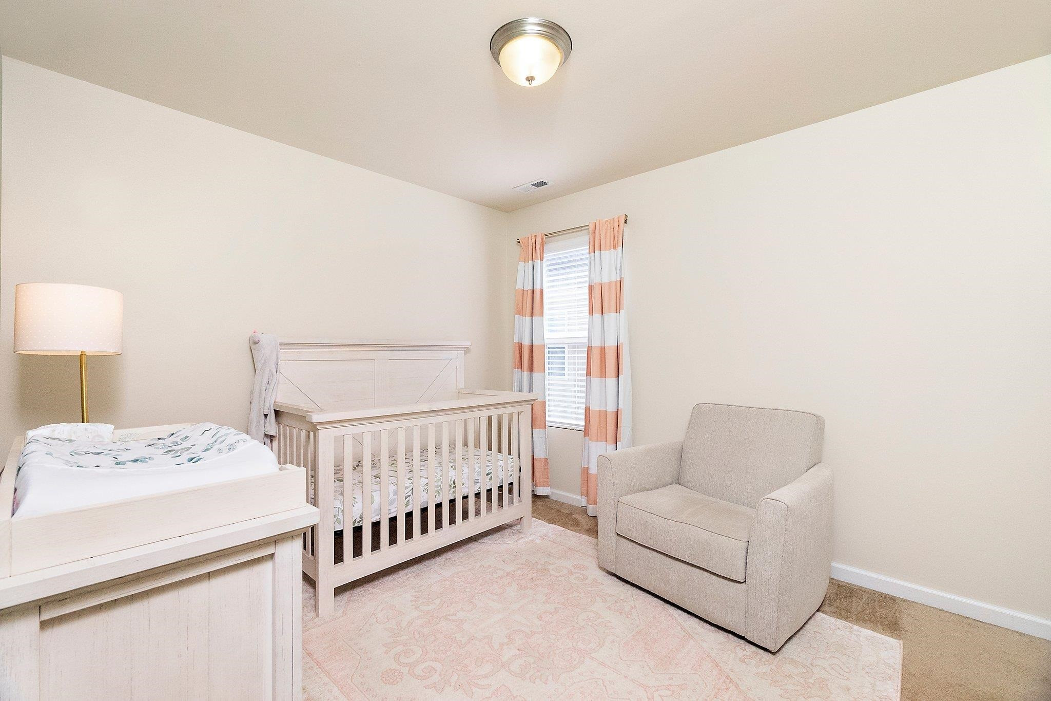3525 Althorp Drive Raleigh, NC 27616 - Photo 23 of 28 a bedroom with furniture and a window