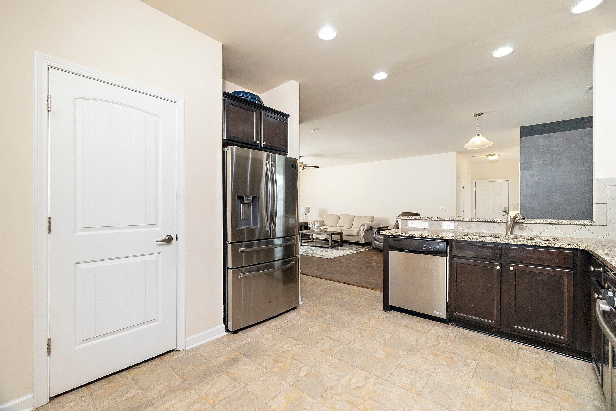3525 Althorp Drive Raleigh, NC 27616 - Photo 6 of 28 a kitchen with stainless steel appliances granite countertop a refrigerator and a sink