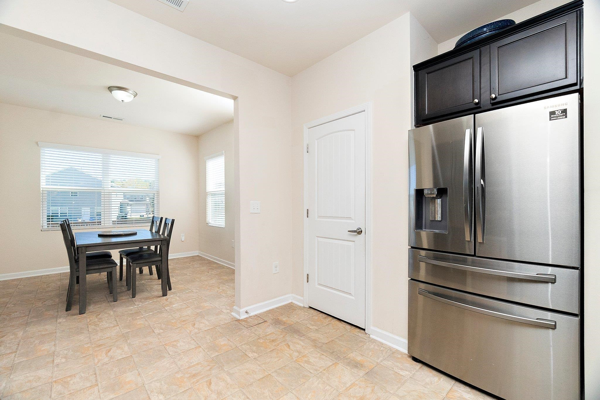 3525 Althorp Drive Raleigh, NC 27616 - Photo 7 of 28 a kitchen with stainless steel appliances granite countertop a refrigerator and a stove top oven