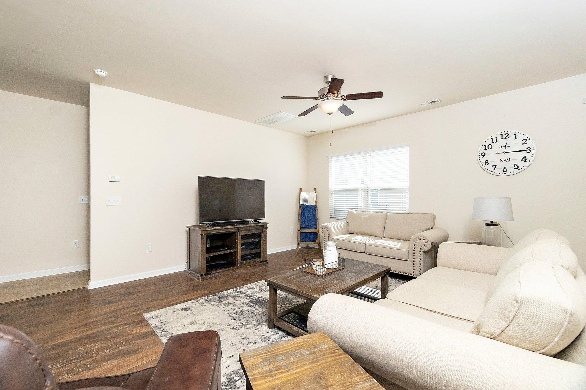 3525 Althorp Drive Raleigh, NC 27616 - Photo 9 of 28 a living room with furniture and a flat screen tv