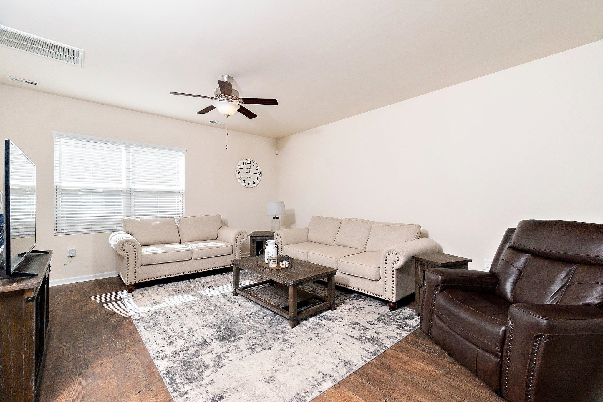 3525 Althorp Drive Raleigh, NC 27616 - Photo 10 of 28 a living room with furniture ceiling fan and a window
