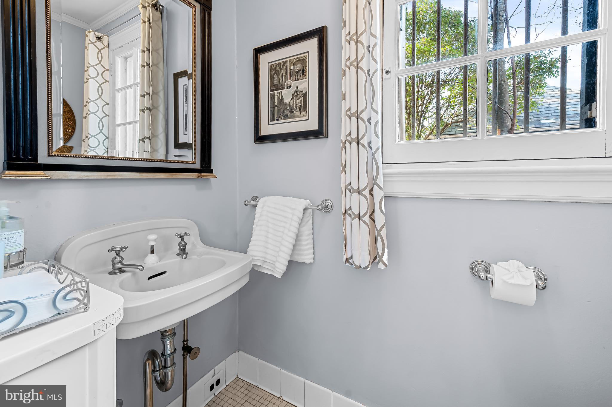 216 Wendover Road Baltimore, MD 21218 - Photo 11 of 83 Half bath on main level (in foyer area)