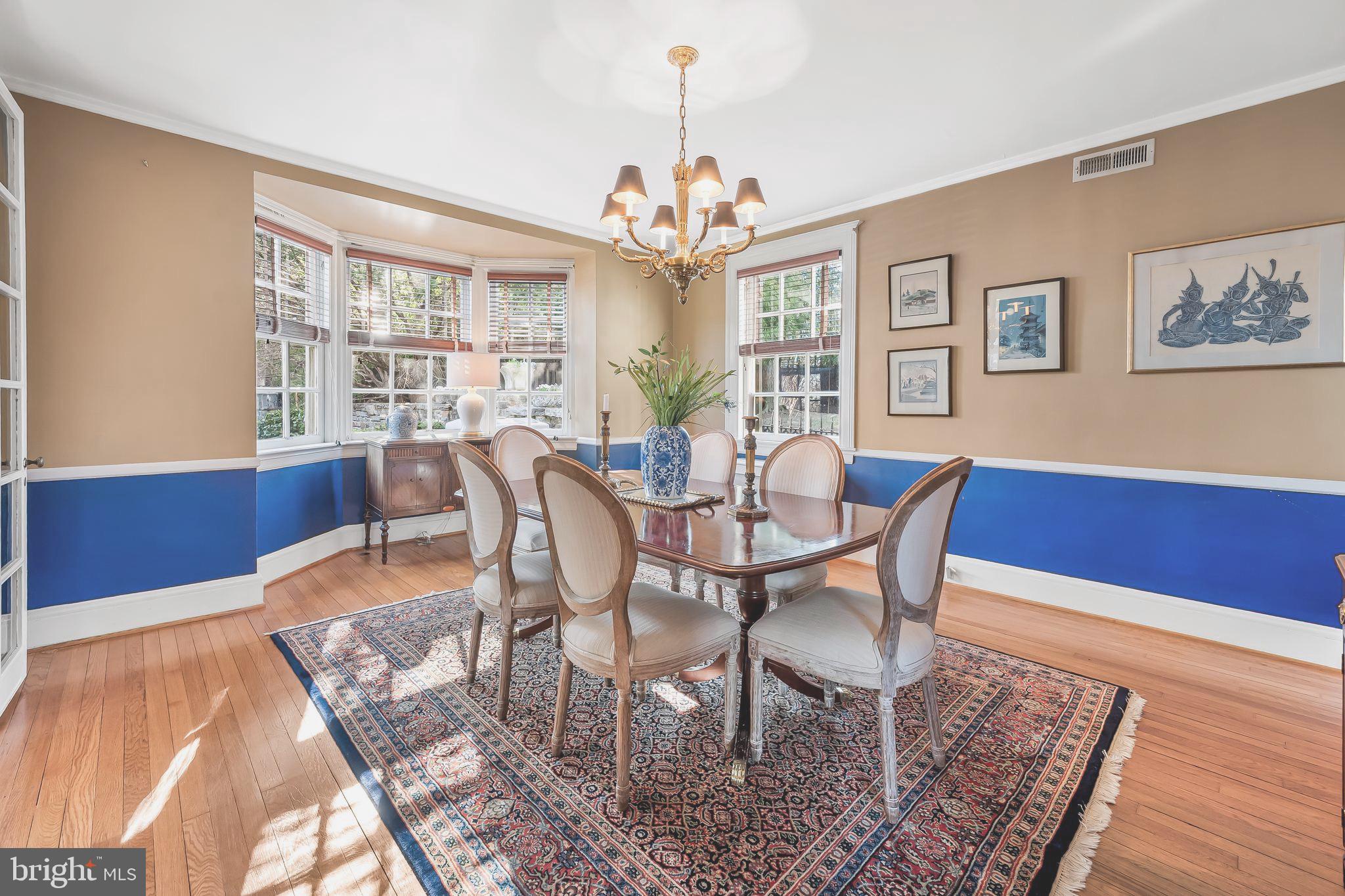 216 Wendover Road Baltimore, MD 21218 - Photo 19 of 83 Dining room with a bay window and hardwood floors