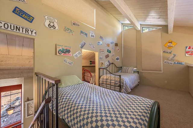 a bedroom with furniture and wooden floor