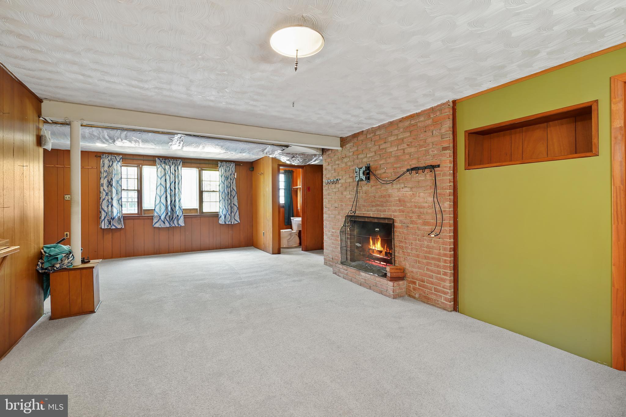 4800 Sharon Road Temple Hills, MD 20748 - Photo 24 of 38 Recreation Room with a Brick Fireplace