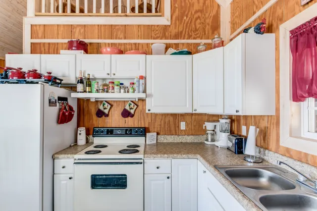 a kitchen with a stove and cabinets