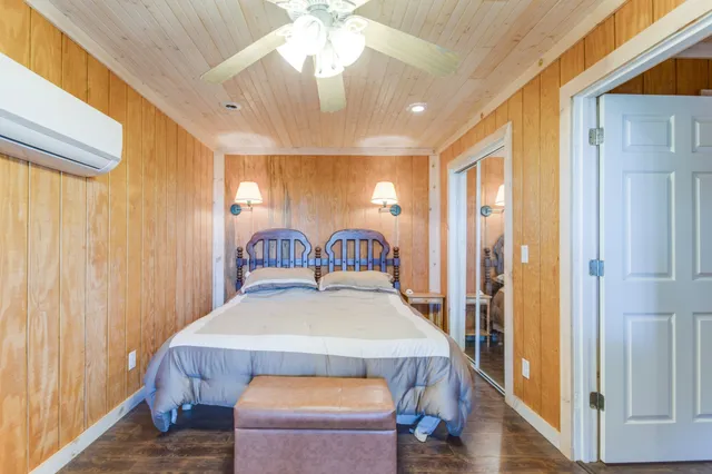 a bedroom with a bed and a table