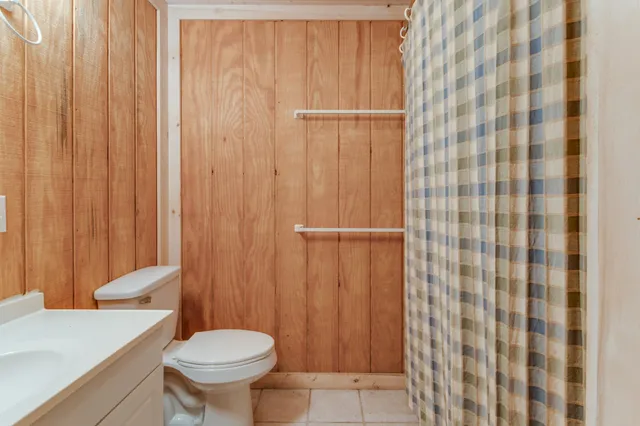 a view of entryway with wooden floor and door
