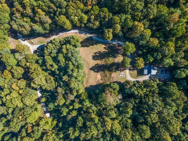 a view of a roof deck with wooden floor and fence