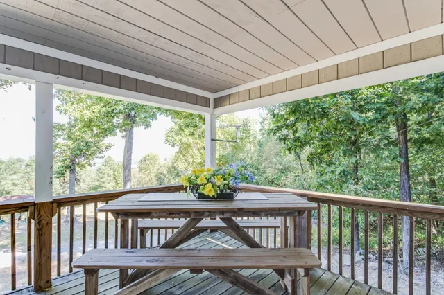 a view of porch with a furniture
