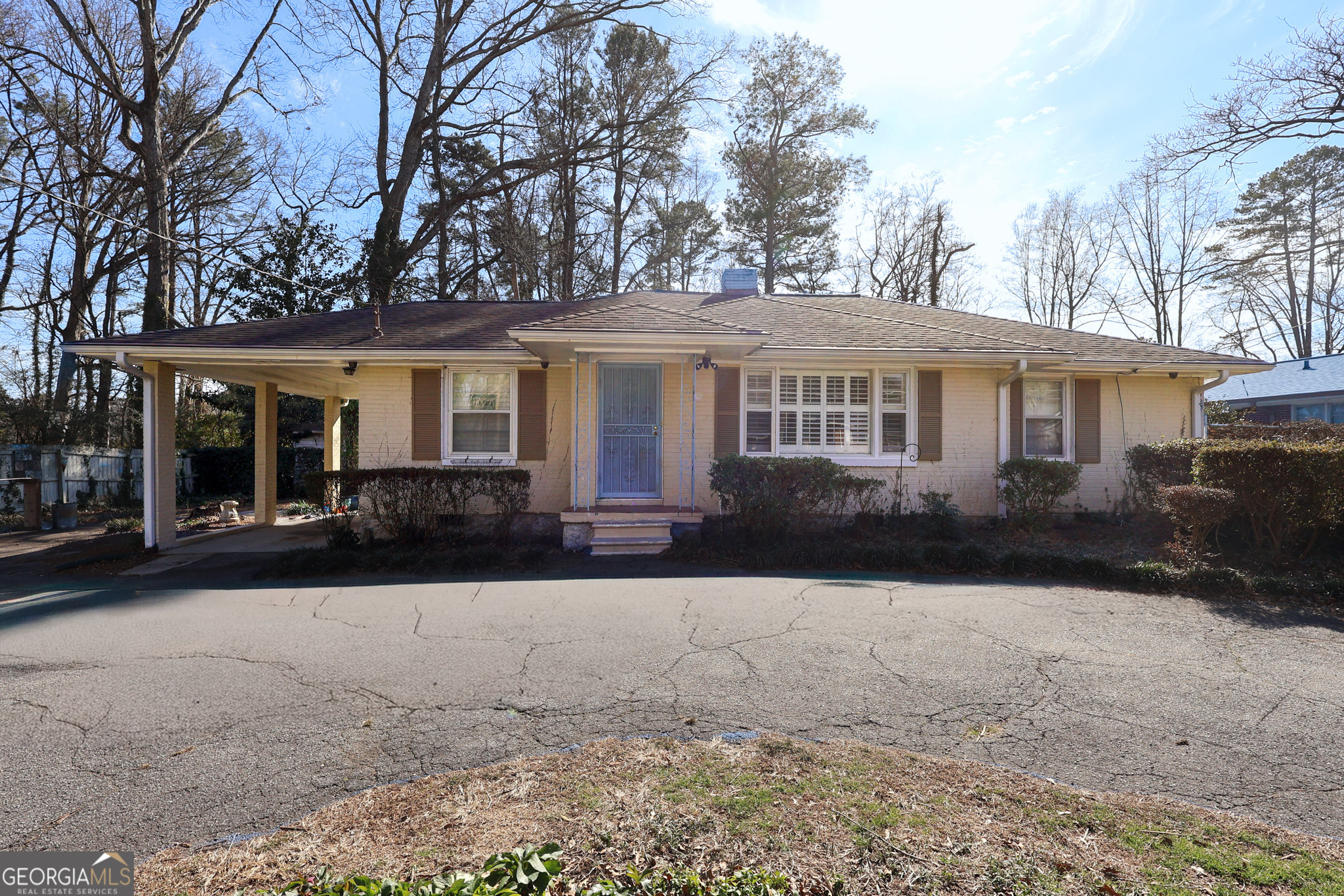 a front view of a house with yard patio and glass windows