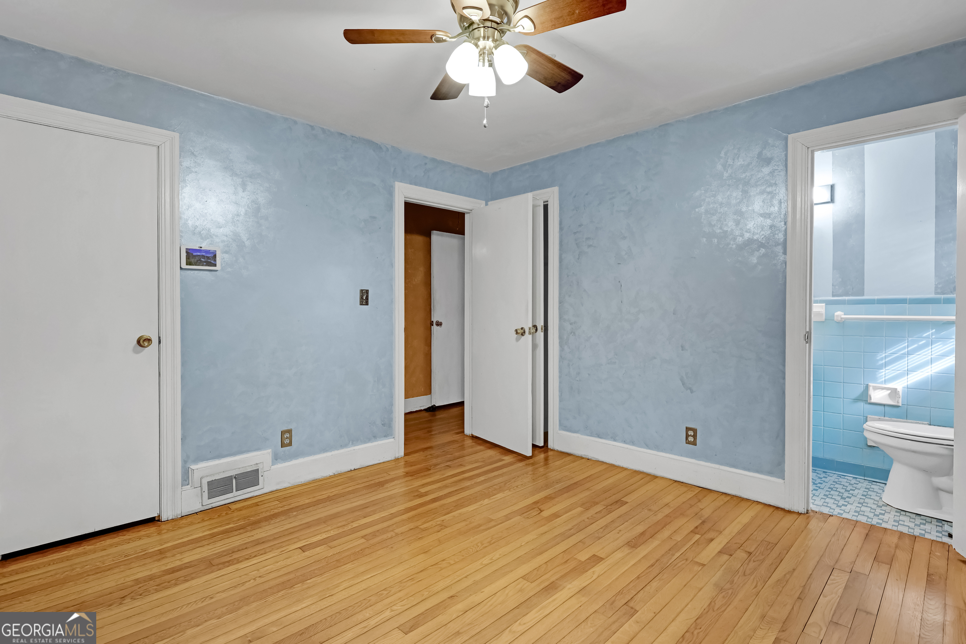1077 Helen Street Morrow, GA 30260 - Photo 14 of 18 a view of empty room with wooden floor