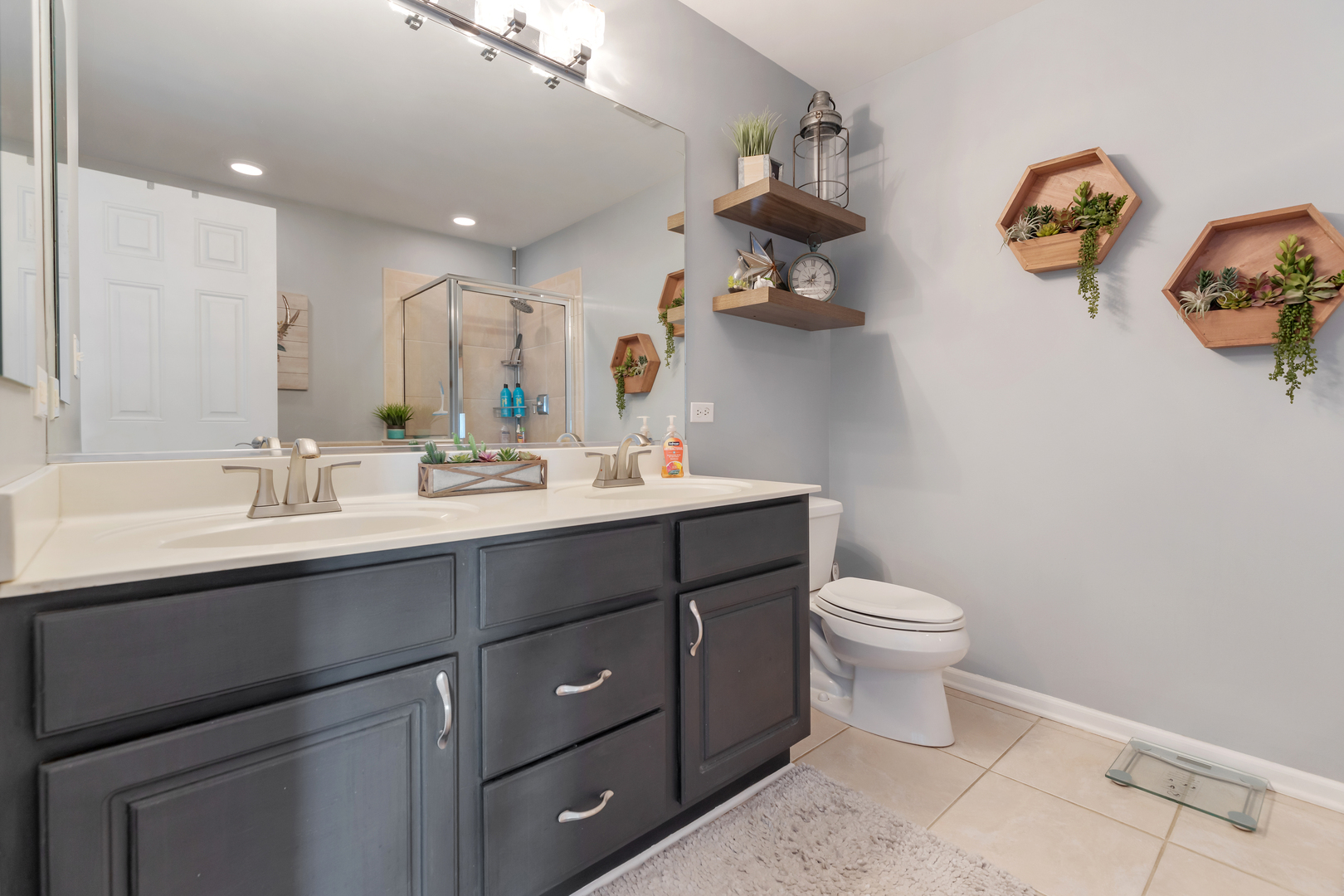 1016 Inverness Drive Antioch, IL 60002 - Photo 14 of 24 a bathroom with a sink vanity and toilet