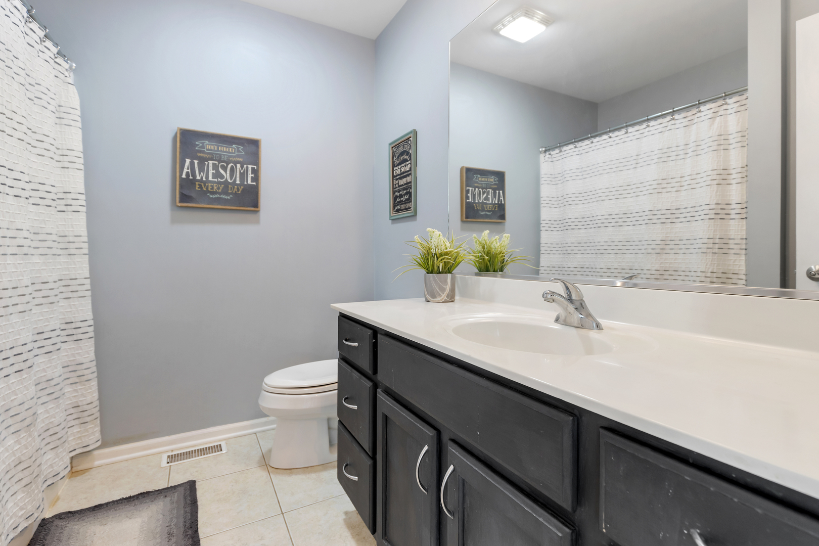 1016 Inverness Drive Antioch, IL 60002 - Photo 17 of 24 a bathroom with a sink a toilet and mirror