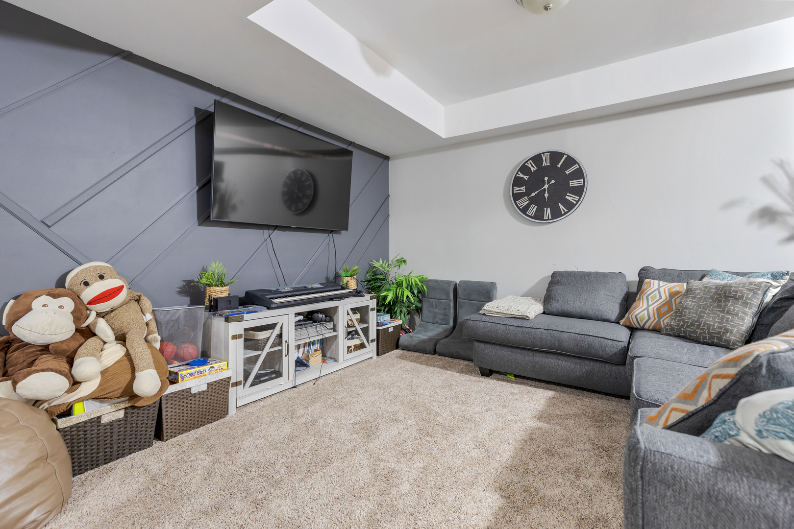 1016 Inverness Drive Antioch, IL 60002 - Photo 21 of 24 a living room with furniture and a flat screen tv