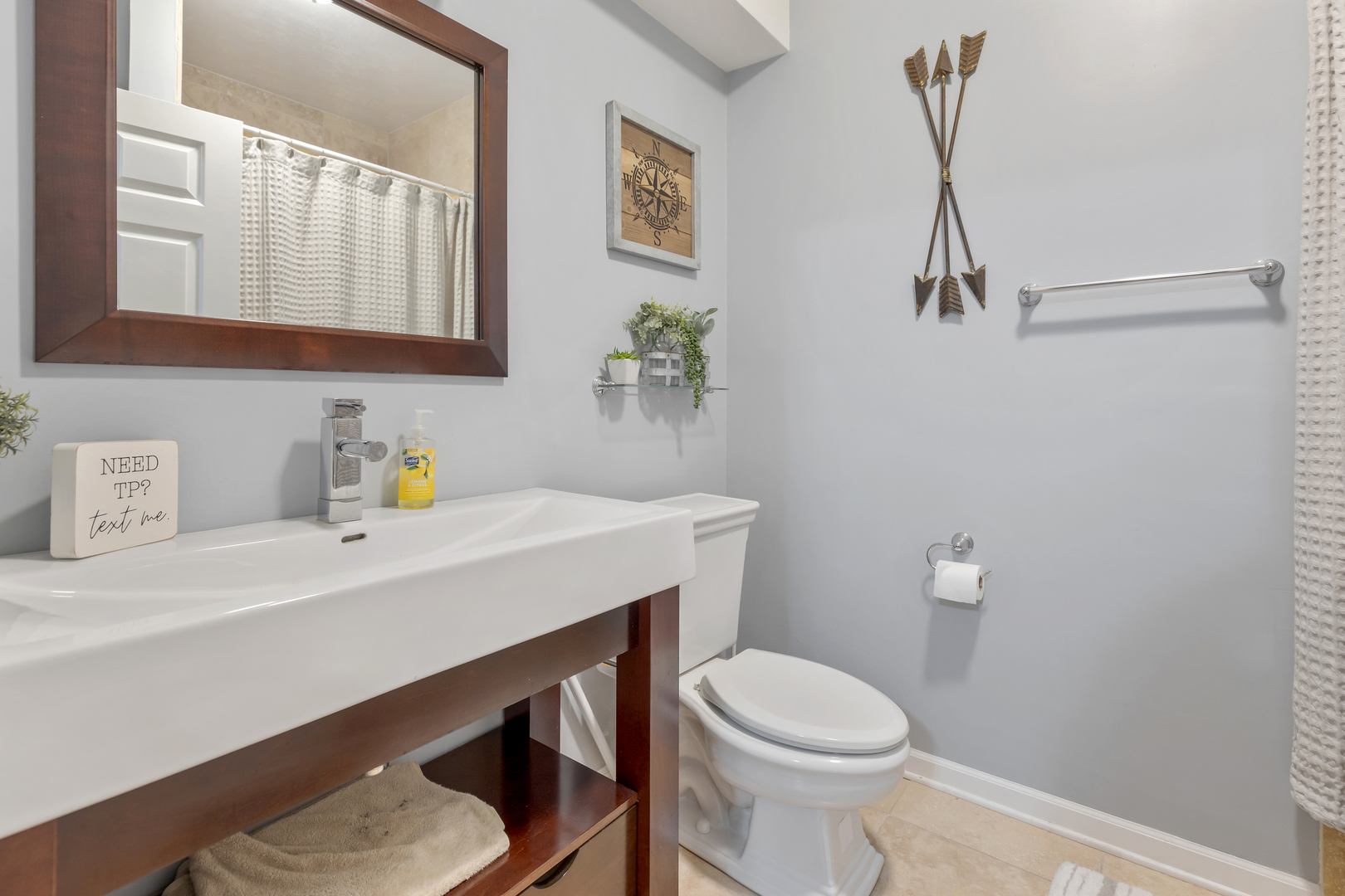 1016 Inverness Drive Antioch, IL 60002 - Photo 22 of 24 a bathroom with a sink a toilet and a mirror