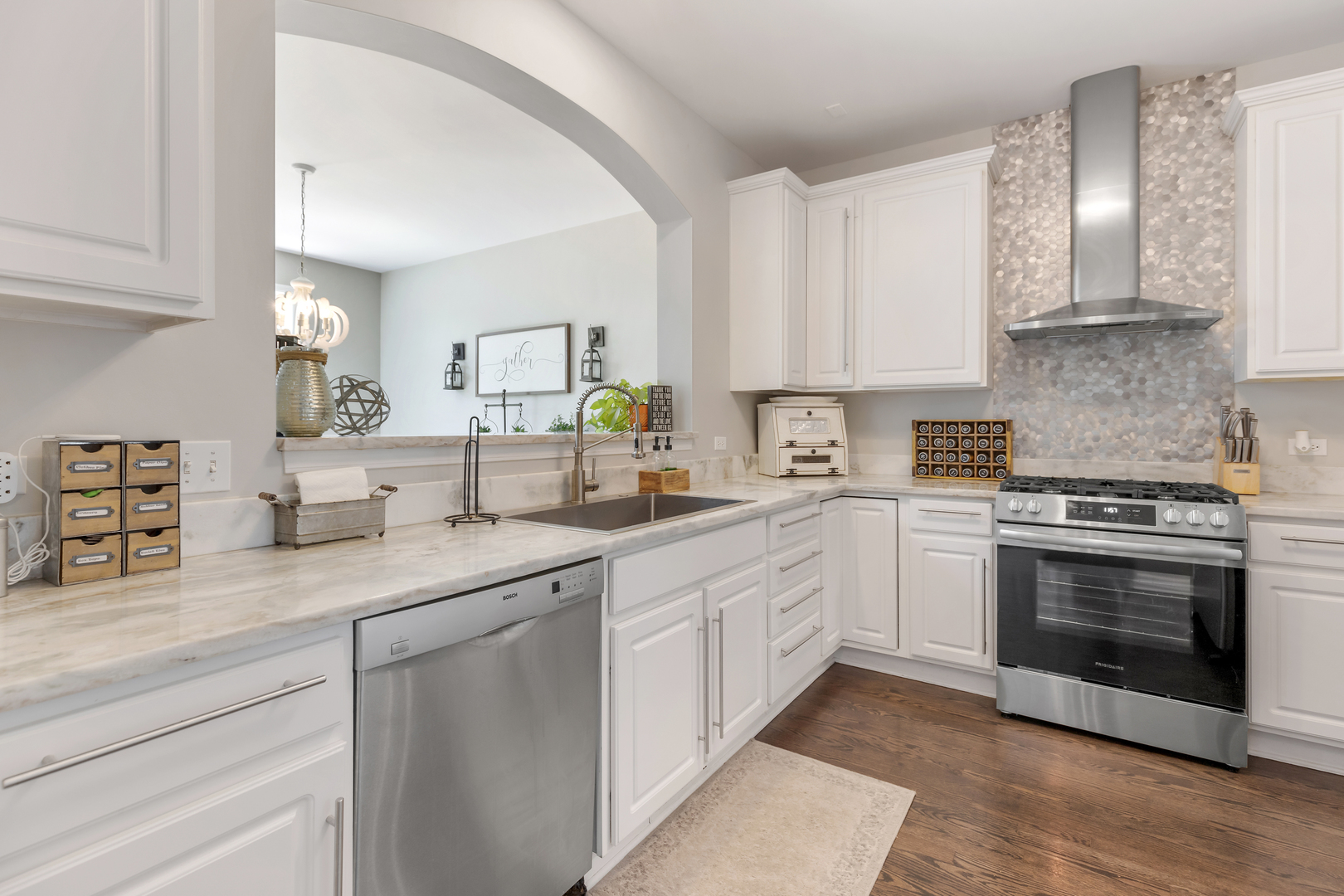 1016 Inverness Drive Antioch, IL 60002 - Photo 4 of 24 a kitchen with granite countertop white cabinets and white stainless steel appliances