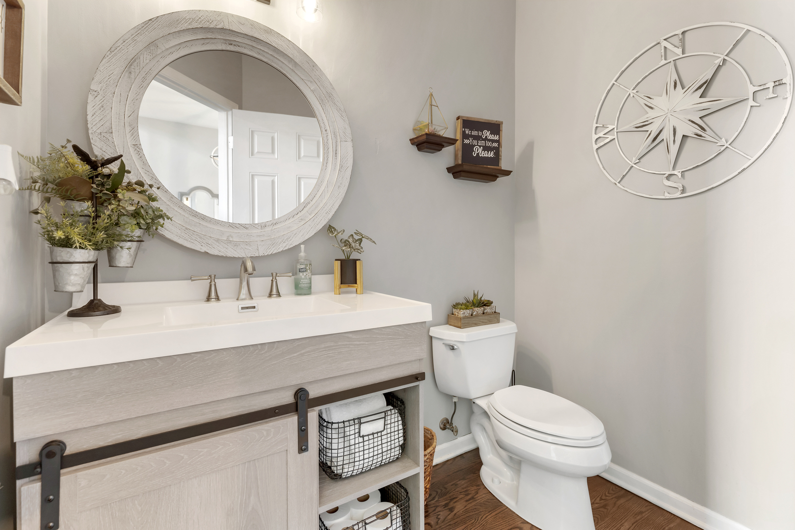 1016 Inverness Drive Antioch, IL 60002 - Photo 7 of 24 a bathroom with a toilet a sink and mirror