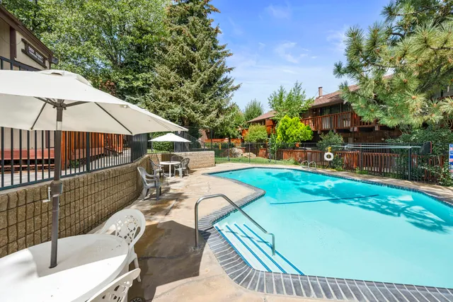 a view of a patio with swimming pool