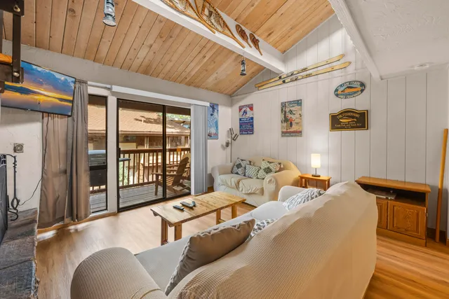 a bedroom with furniture and large window