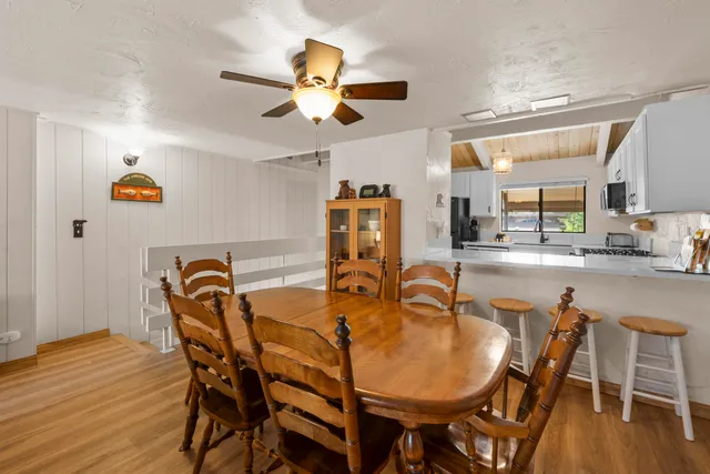 a dining room with furniture and window
