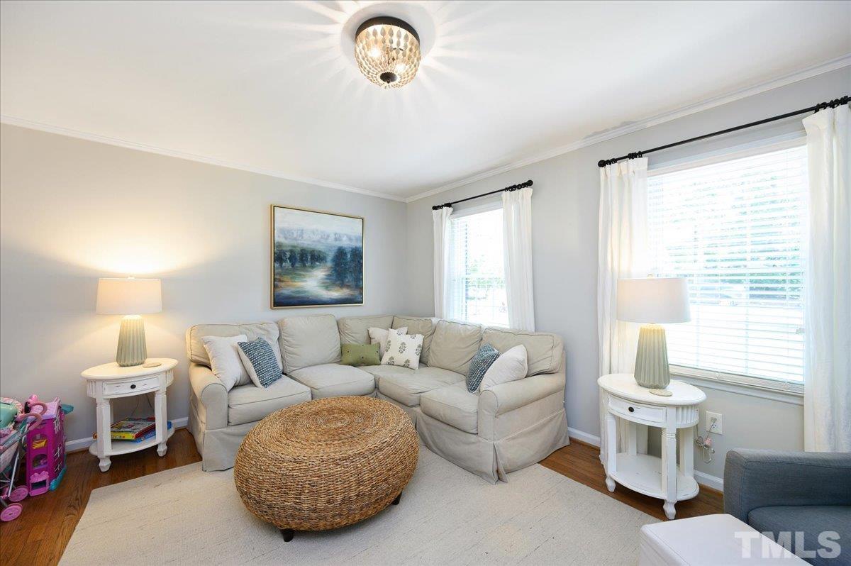 7509 Harps Mill Road Raleigh, NC 27615 - Photo 11 of 31 a living room with furniture a window and a couch
