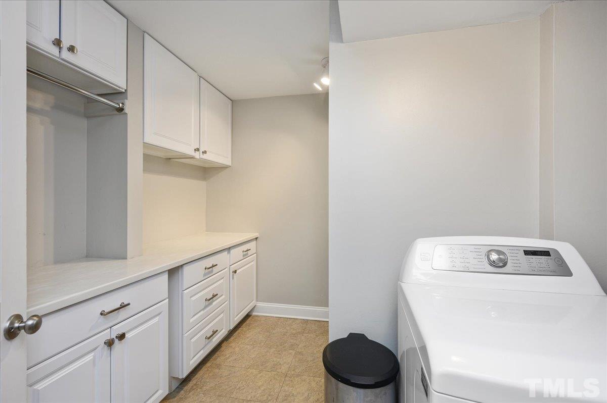 7509 Harps Mill Road Raleigh, NC 27615 - Photo 27 of 31 a utility room with sink dryer and washer