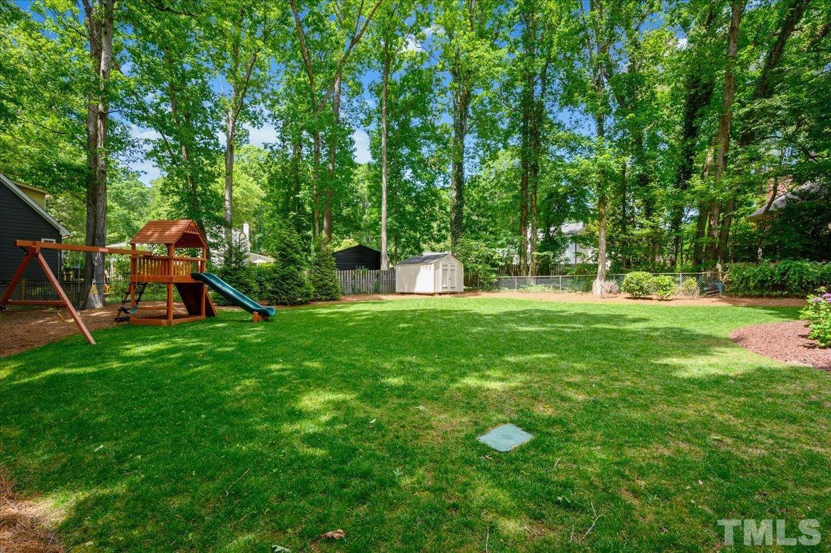 7509 Harps Mill Road Raleigh, NC 27615 - Photo 7 of 31 a view of a park with large trees