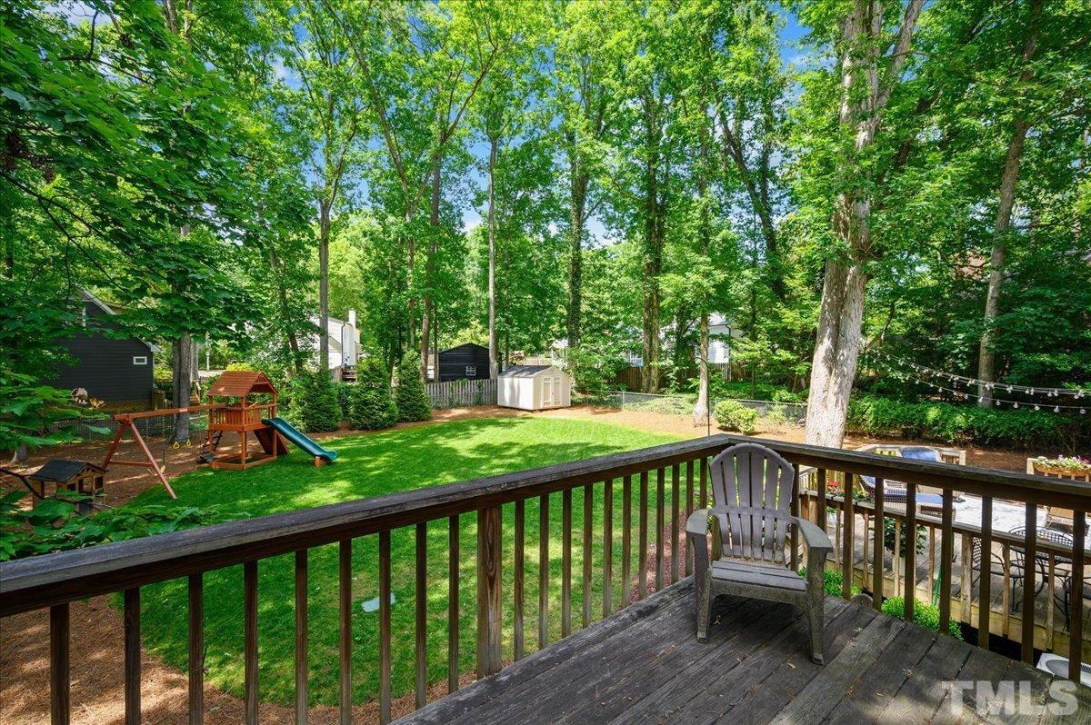 7509 Harps Mill Road Raleigh, NC 27615 - Photo 8 of 31 a view of trees and yard from a balcony