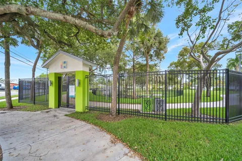 a view of a house with a small yard and plants