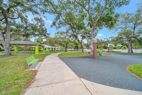 a view of a park with large trees
