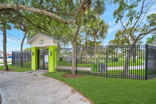 a view of a house with a big yard and plants